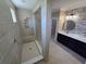 Spacious walk-in shower and double vanity provides spa-like experience in this Primary bathroom at 1521 Sourwood Dr, Ocoee, FL 34761