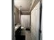 Bathroom with shower, a sink, toilet, granite counter, and a white shower curtain at 1521 Sourwood Dr, Ocoee, FL 34761