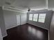 Spacious bedroom with ceiling fan, and three windows that offer natural light at 1521 Sourwood Dr, Ocoee, FL 34761