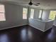 Bright bonus room with lots of natural light and hardwood flooring throughout at 1521 Sourwood Dr, Ocoee, FL 34761