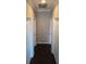 Hallway with hardwood flooring and white doors at 1521 Sourwood Dr, Ocoee, FL 34761
