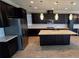 Modern kitchen features a large island, stainless steel appliances, white subway tile, and beautiful floors at 1521 Sourwood Dr, Ocoee, FL 34761