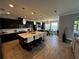 Spacious kitchen features a large island, modern appliances, pendant lighting, and adjacent breakfast nook at 1521 Sourwood Dr, Ocoee, FL 34761