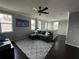 Comfortable living room with a ceiling fan, natural light, and ample space at 1521 Sourwood Dr, Ocoee, FL 34761