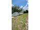 The expansive backyard features a shed and plenty of open space, bordered by a white fence at 1923 Beechwood Dr, Lakeland, FL 33803