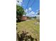 The backyard features a well-maintained lawn and a fire pit, perfect for outdoor enjoyment at 1923 Beechwood Dr, Lakeland, FL 33803