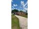 Inviting single-story home featuring a long driveway and a covered carport at 1923 Beechwood Dr, Lakeland, FL 33803