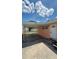 View of the home's side entrance and attached carport with a storage shed at 1923 Beechwood Dr, Lakeland, FL 33803
