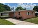 Charming single-story home with a carport and a well-maintained front yard at 1923 Beechwood Dr, Lakeland, FL 33803