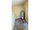 A utility room with a water heater and an unfinished concrete floor at 1923 Beechwood Dr, Lakeland, FL 33803