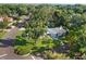 Stunning aerial view of a well-manicured property featuring lush landscaping and a sparkling pool at 2110 Reaney Rd, Lakeland, FL 33803