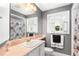 Bathroom featuring a sink, vanity and a combination bathtub and shower at 2110 Reaney Rd, Lakeland, FL 33803