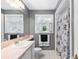 Bathroom featuring a sink, vanity and a combination bathtub and shower at 2110 Reaney Rd, Lakeland, FL 33803