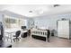 Stylish bedroom with lots of natural light features modern furniture, vinyl flooring and decor at 2110 Reaney Rd, Lakeland, FL 33803