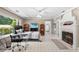 Spacious bedroom featuring a fireplace, desk, and a large window for natural light at 2110 Reaney Rd, Lakeland, FL 33803