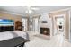 Bedroom featuring a fireplace and multiple access doors to additional rooms at 2110 Reaney Rd, Lakeland, FL 33803