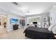Bright bedroom with painted brick wall, decorative light fixture, work space and large sliding glass door at 2110 Reaney Rd, Lakeland, FL 33803