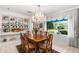 Dining room with large windows, chandelier and views of the manicured yard at 2110 Reaney Rd, Lakeland, FL 33803