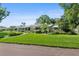 A well-maintained home boasts a lush green lawn, manicured shrubs, and a welcoming entrance at 2110 Reaney Rd, Lakeland, FL 33803