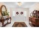 Inviting foyer features tile flooring, a chandelier, and a classic double-door entrance with decorative wreaths at 2110 Reaney Rd, Lakeland, FL 33803