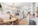 Open kitchen with a breakfast nook featuring white cabinetry, updated appliances, and ample countertop space at 2110 Reaney Rd, Lakeland, FL 33803
