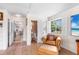 Cozy bonus room with a comfy leather chair, tile floors, and a view of an outdoor scene on TV at 2110 Reaney Rd, Lakeland, FL 33803