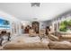 Elegant living room boasts plush furnishings, and a view of the lanai at 2110 Reaney Rd, Lakeland, FL 33803