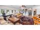 Large living room with comfortable seating, built-in desk, and access to backyard at 2110 Reaney Rd, Lakeland, FL 33803