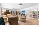 Spacious living room features French doors, comfortable seating, and ample natural light at 2110 Reaney Rd, Lakeland, FL 33803