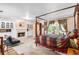 Spacious main bedroom with a fireplace, sitting area, and doors leading to an outdoor space at 2110 Reaney Rd, Lakeland, FL 33803