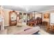 Large main bedroom featuring a four-poster bed, sitting area, and charming details at 2110 Reaney Rd, Lakeland, FL 33803