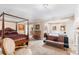 Bright and airy main bedroom with a sitting area, fireplace, and a cozy ambiance at 2110 Reaney Rd, Lakeland, FL 33803