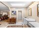 Vanity in the main bedroom with white cabinets, tiled floor, and a makeup area at 2110 Reaney Rd, Lakeland, FL 33803