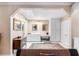 Vanity area features a skylight, white cabinets, and tiled floors in the main bedroom at 2110 Reaney Rd, Lakeland, FL 33803