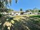 Spacious backyard with mature trees and lawn, perfect for outdoor activities, gatherings, and relaxing at 4128 Palo Alto Dr, Lakeland, FL 33813