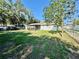The spacious yard is enhanced by mature trees, providing ample shade and creating a serene outdoor environment at 4128 Palo Alto Dr, Lakeland, FL 33813