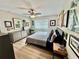 Bedroom featuring natural light, a ceiling fan, and tasteful decor, providing a cozy and stylish retreat at 4128 Palo Alto Dr, Lakeland, FL 33813