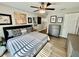 Comfortable bedroom with a ceiling fan and plenty of decorative artwork for an inviting personal space at 4128 Palo Alto Dr, Lakeland, FL 33813