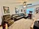 Relaxing bonus room with gaming setup, comfy seating, a ceiling fan, and carpet flooring at 4128 Palo Alto Dr, Lakeland, FL 33813
