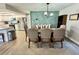 Open dining room featuring modern lighting, a decorative wall and view of the kitchen at 4128 Palo Alto Dr, Lakeland, FL 33813
