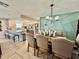 Dining area with decorative wall, modern lighting fixture, and a view of the kitchen island at 4128 Palo Alto Dr, Lakeland, FL 33813