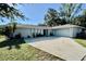 Charming single-story home with a well-maintained lawn, spacious driveway and two car garage at 4128 Palo Alto Dr, Lakeland, FL 33813