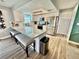 Modern kitchen with granite countertops, stainless steel appliances, and a breakfast bar with bench seating at 4128 Palo Alto Dr, Lakeland, FL 33813