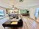 Spacious living room with open floor plan to dining room, kitchen and access to the outside patio at 4128 Palo Alto Dr, Lakeland, FL 33813