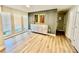 Bright living room featuring modern design elements, light hardwood flooring, and a decorative wall feature at 4128 Palo Alto Dr, Lakeland, FL 33813