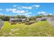 Fenced backyard includes a screened patio, a garden area, and a storage shed, offering private outdoor space at 21551 Lake Seneca Rd, Eustis, FL 32736