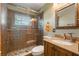 Bathroom featuring decorative fixtures, vanity, and a glass-enclosed walk-in shower at 21551 Lake Seneca Rd, Eustis, FL 32736