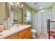 Functional bathroom featuring a shower with curtain, vanity, and tile flooring at 21551 Lake Seneca Rd, Eustis, FL 32736