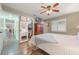 Bedroom featuring walk-in closet, a TV, and tile flooring throughout at 21551 Lake Seneca Rd, Eustis, FL 32736