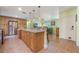 Spacious kitchen featuring a large island with granite countertops and modern appliances at 21551 Lake Seneca Rd, Eustis, FL 32736
